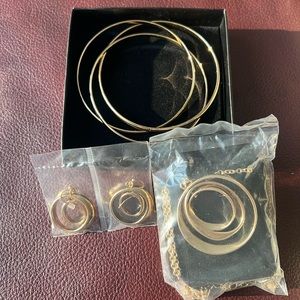 Three piece set: earrings, necklace and bangles.